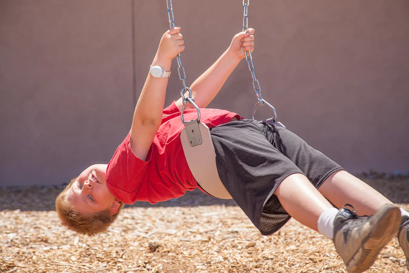 Student enjoying outdoor activities at ASCEND school in golden sunlight